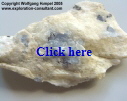 Marosohihy Mine: subhedral, bright blue corundum (3 cm wide) in white plagioclasite.