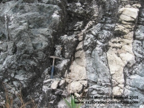 Marosohihy Uranothorianite Mine: contact zone of pyroxenite (left), granitic dikes and marble.